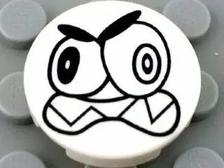 White Tile, Round 2 x 2 with Bottom Stud Holder with Black Large Eyes and Scowl with Sharp Teeth (Ni