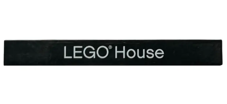Black Tile 1 x 8 with White 'LEGO House', Thin Font with Arrowhead 'G' Pattern