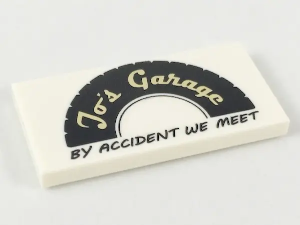 White Tile 2 x 4 with Black Tire Half with Tan 'Jo's Garage' and Black 'BY ACCIDENT WE MEET' Pattern