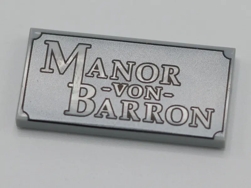 Light Bluish Gray Tile 2 x 4 with 'Manor von Barron' Pattern