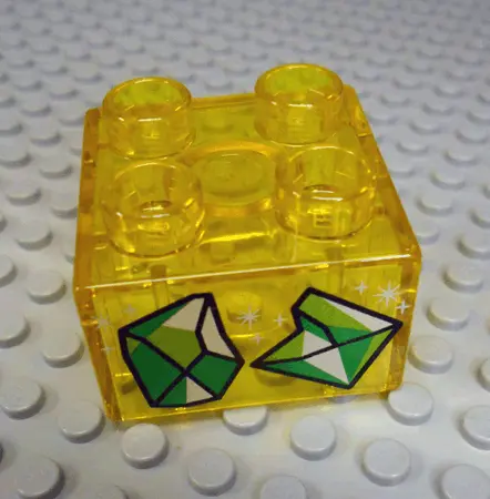 Trans-Yellow Duplo, Brick 2 x 2 with 2 Sparkling Green Gems Pattern