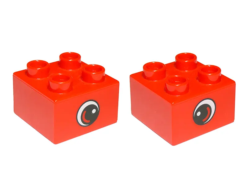 Red Duplo, Brick 2 x 2 with Eye, Small with White Spot and Curve Pattern on Opposite Sides