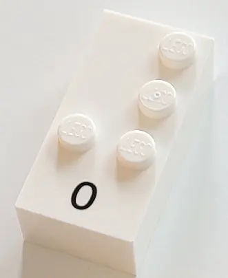 White Brick, Braille 2 x 4 with 4 Studs with Black Number 0 Pattern (dots-3456 ⠼) (French with Antoi