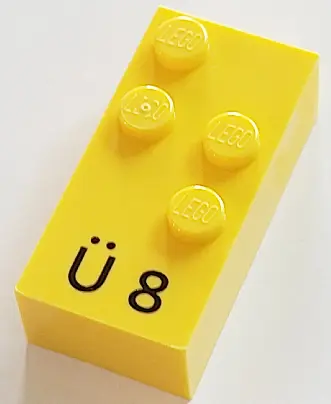 Yellow Brick, Braille 2 x 4 with 4 Studs with Black Capital Letter U with Diaeresis (Ü) / Number 8 P