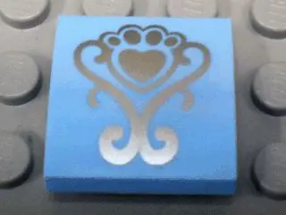Bright Light Blue Slope, Curved 2 x 2 x 2/3 with Silver Fancy Scroll and Heart Shaped Paw Pattern