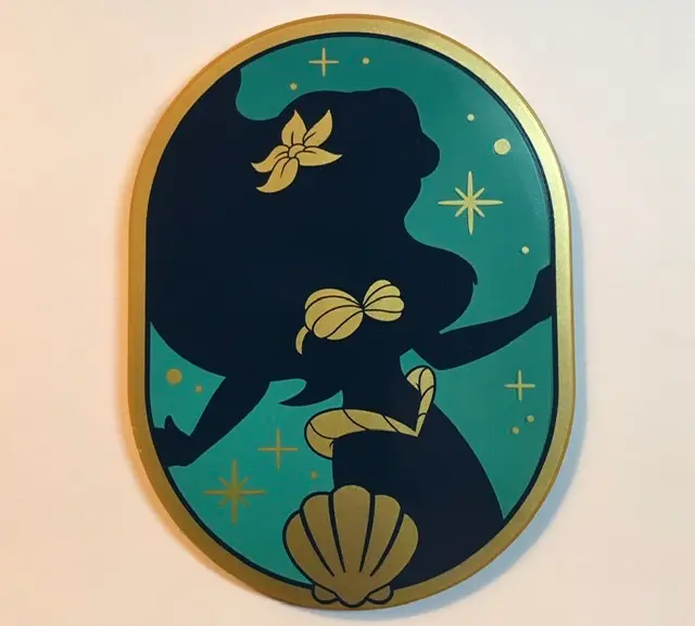 Pearl Gold Tile, Round 6 x 8 Oval with Dark Blue Ariel Silhouette with Flower and Shell Bra, Gold Do
