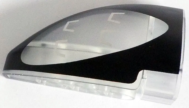 Trans-Clear Technic, Panel Curved 5 x 3 x 2 Corner Quarter Ellipse, Right with Black and Silver Pors