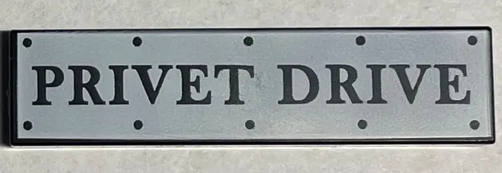 Black Tile 1 x 4 with Road Sign with 'PRIVET DRIVE' and Rivets on White Background Pattern