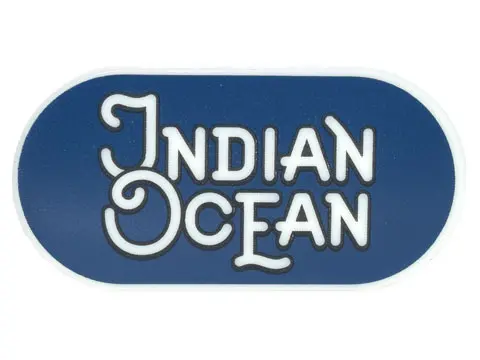Glow In Dark White Tile, Round 2 x 4 Oval with Black Outline 'INDIAN OCEAN' on Dark Blue Background 