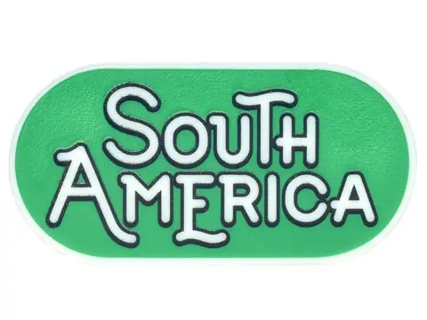 Glow In Dark White Tile, Round 2 x 4 Oval with Black Outline 'SOUTH AMERICA' on Green Background Pat