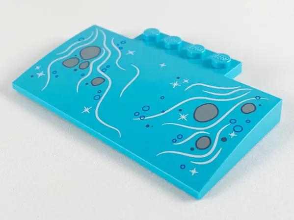 Medium Azure Slope, Curved 5 x 8 x 2/3 with 4 Studs with Bubbles and Light Bluish Gray Rocks in Stre