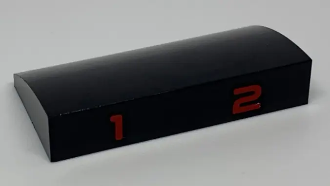 Black Slope, Curved 2 x 4 x 2/3 with Bottom Tubes with Red Number 1 and 2 Pattern