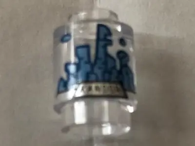 Trans-Clear Brick, Round 1 x 1 with Medium Blue and Gold Kandor Skyline Pattern