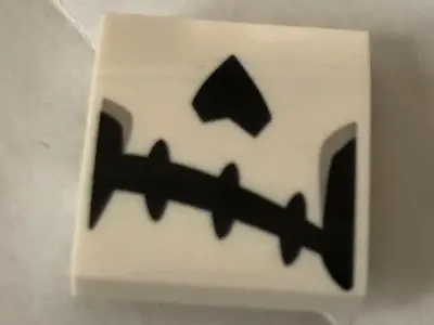 White Slope, Curved 2 x 2 x 2/3 with Skeletal Mouth and Nose Pattern