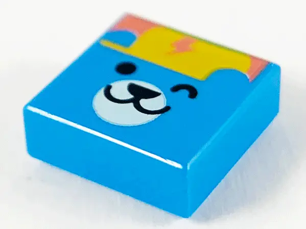 Dark Azure Tile 1 x 1 with Winking Bear Face, Bright Light Orange Cap and Coral Lightning Bolt Patte