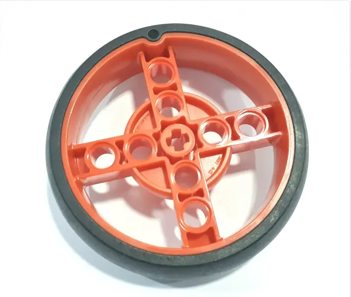 Red Wheel 56 x 14 Technic with Axle Hole and 8 Pin Holes with Molded Black Hard Rubber Tire Pattern