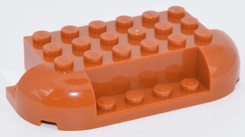 Orange Brick, Round 4 x 8 x 1 1/3 with 2 Curved Corners, 1 x 4 Cutout on Side, 2 x 1 Cutouts on Ends
