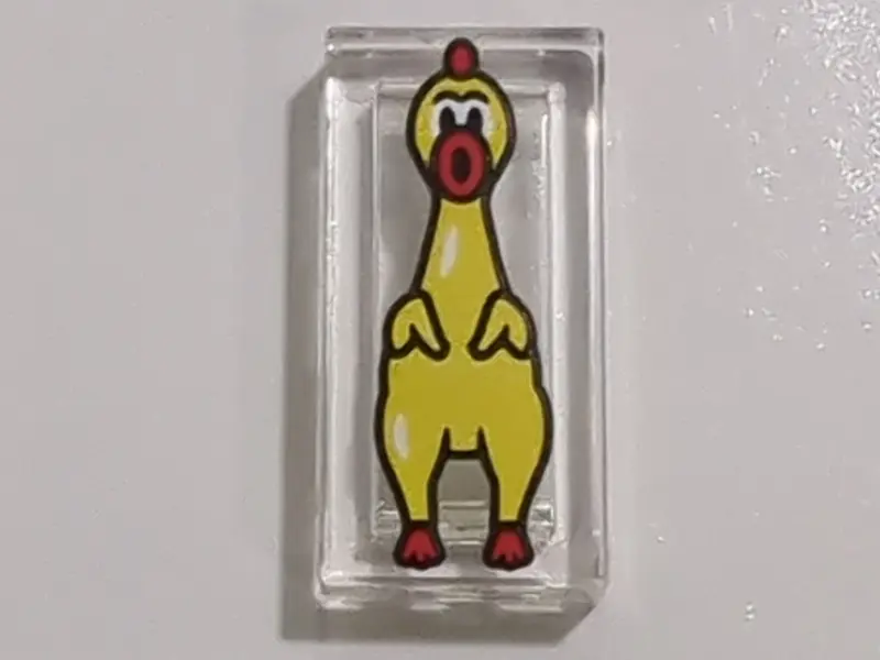 Tile 1 x 2 with Yellow and Red Rubber Chicken Pattern